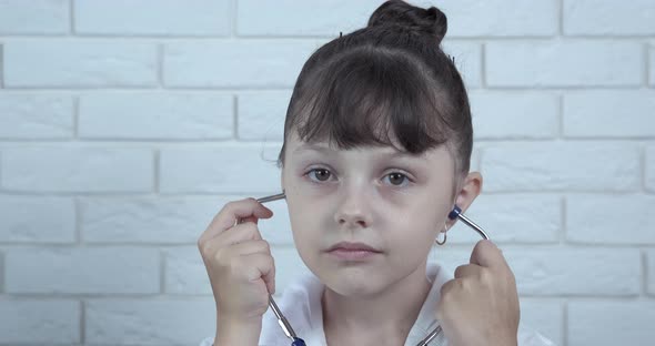 Puts Stethoscope in Ears alt