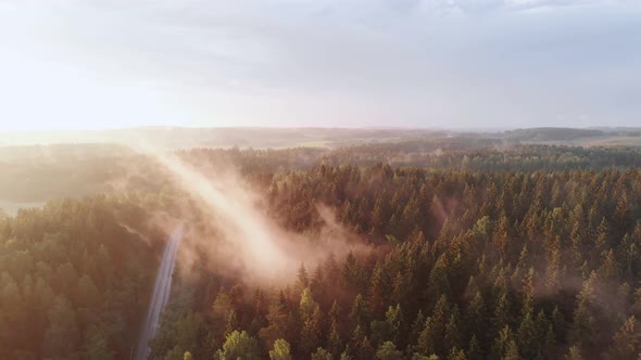 Incredible Breathtaking Aerial View of Movement of Steam Over Green Forest alt