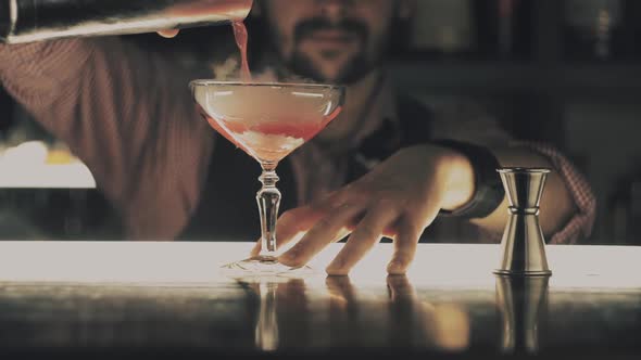 Barman Make a Cocktail on a Bar