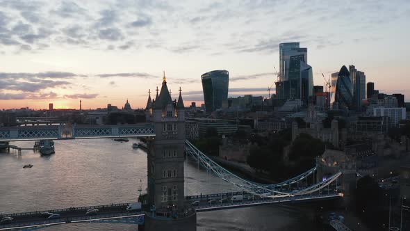 Forwards Fly Above Thames River Towards One of Pillars of Tower Bridge alt
