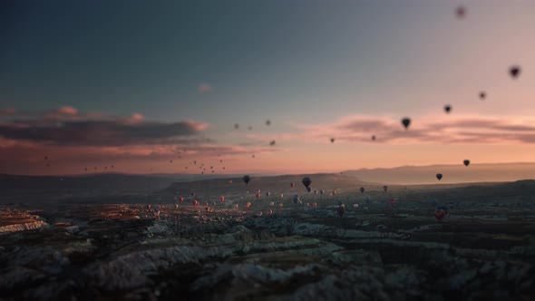 Miniature Footage with Tilt Shift Effect of Flying Hot Air Balloons Over Cappadocia Limestone Valley alt