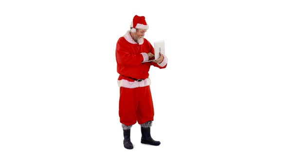 Santa claus using laptop alt