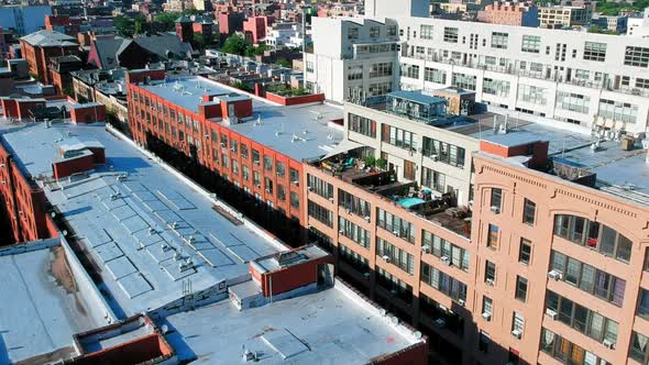 Large apartment buildings in Brooklyn, NYC across from Manhattan, panning shot alt