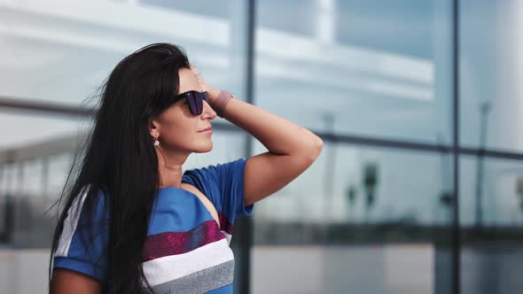 Closeup Trendy Tourist Brunette Lady in Sunglasses Waiting Boarding Flight Outdoor Departure Area alt