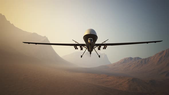 Sophisticated armed military drone (UAV) flying smoothly over a vast desert. 4K