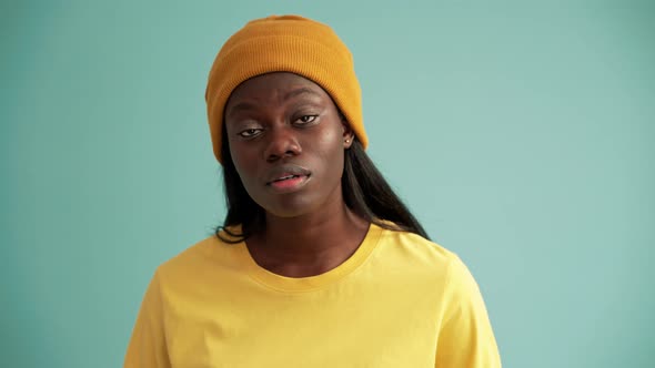 Bored African woman rolling eyes alt