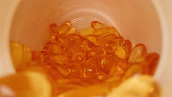 Camera pulls out of a bottle of vitamins alt