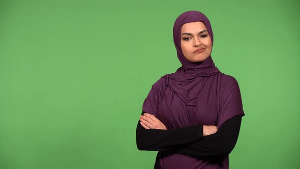 A Young Beautiful Muslim Woman Shakes Her Head at the Camera  Green Screen Background