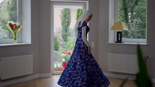 Charming Young Slim Muslim Woman in Hijab and Wedding Dress Spinning Looking at Camera alt
