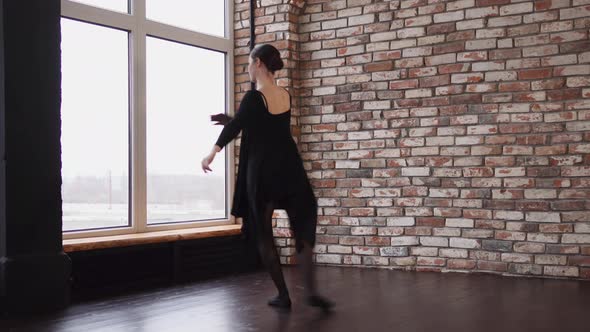 Modern Ballerina Is Dancing in a Loft Room Whirling alt