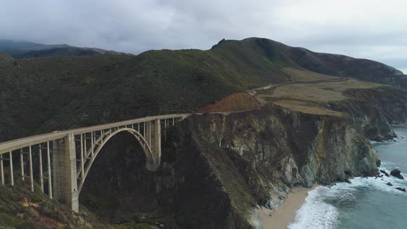 Car on Bixby Creek Bridge. Pacific Ocean. Big Sur, California, USA. Aerial View
