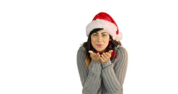 Woman in santa hat and warm clothing blowing over hands 4k alt