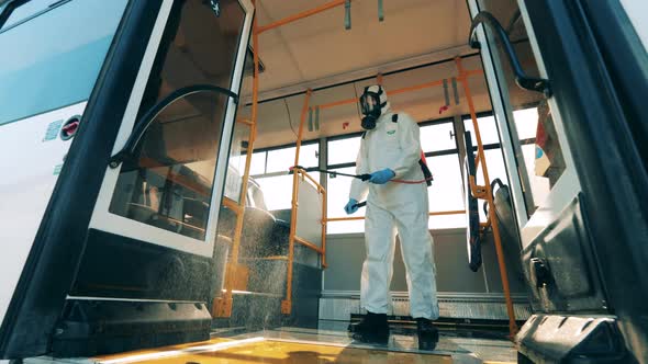 Inside View of a Bus Getting Chemical Treatment alt