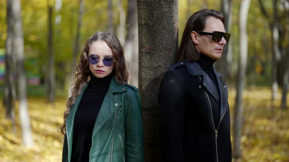 Misunderstanding and Breakup of Loving Couple Woman is Walking Away From Her Boyfriend alt