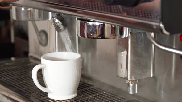 The Coffee Machine Adds Boiling Water Into the Cup