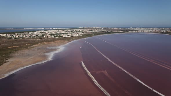 Aerial View of Pink Lake of Las Salinas Torrevieja Cityscape and the Mediterranean Sea Costa Blanca alt