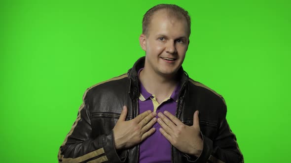 Choose Me. Rocker Man Pointing Himself and Looking at Camera. Expressing Pride in His Achievements alt