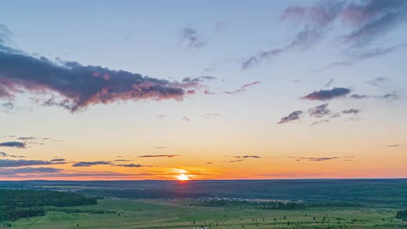 Beautiful Evening Sunset, Time Lapse, Movement of Clouds of a Different Level Against the Setting alt