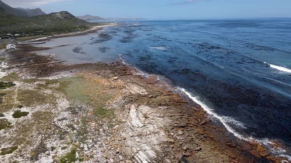 Aerial view of Atlantic Ocean Misty Cliffs coastline, Cape Town, South Africa. alt