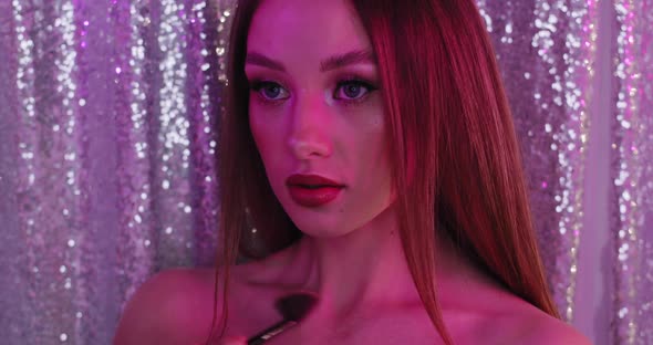 Glamour Girl with Perfect Makeup in Pink Light alt