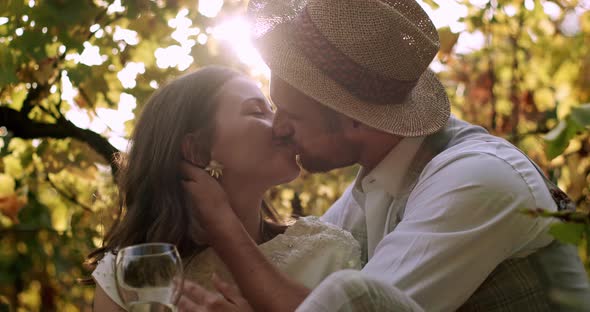 Bride and Groom Kissing in Vineyard