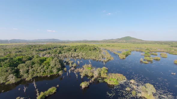 Aerial: High lansdcape shot of Botanical Garden in Rayong, Thailand. Circular tracking shot of float alt