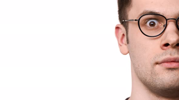 Half Side Portrait of Caucasian Serious Man 20s Wearing Glasses Bulging His Eyes and Expressing alt