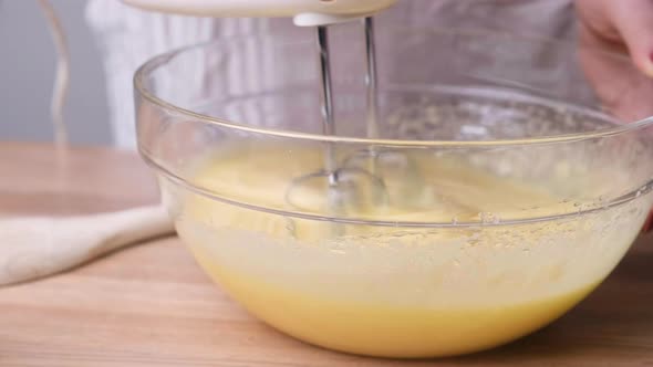 Mixing Carrot Cake Ingredients In A Bowl With An Electric Mixer. close up alt