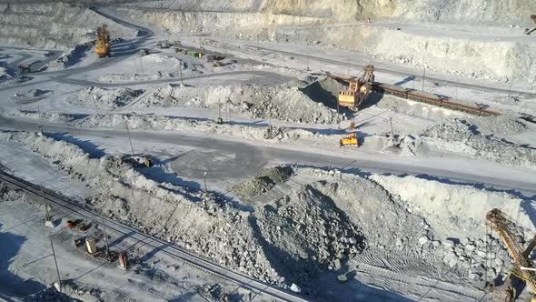 Excavator Loads Platforms for Rock Transportation on Pit alt