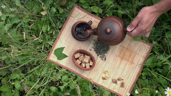 Tea in Nature. Flat Lay. Slow Motion 2x. alt