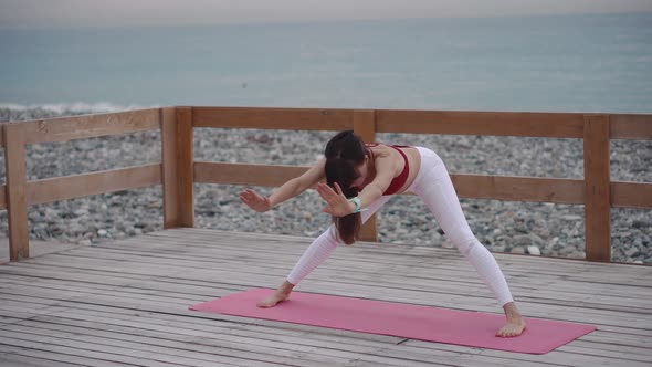 Woman Is Performing Yoga Asana Outdoors, Hatha Yoga Practice alt