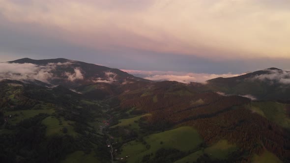 Foothill Village in a Hilly Landscape After the Rain at Sunset