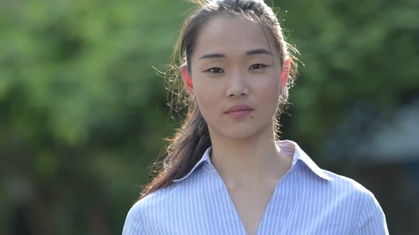 Young Happy Beautiful Asian Businesswoman Outdoors