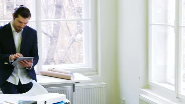 Businessman using digital tablet alt