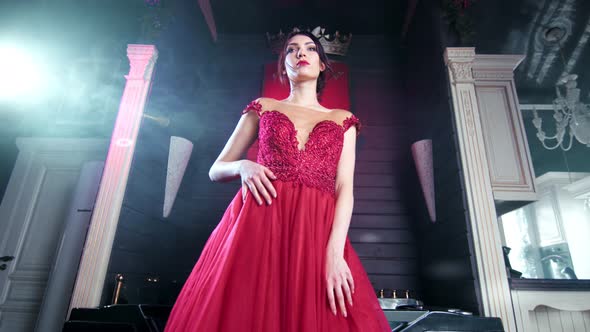 Beautiful Elegant Woman in Amazing Evening Red Dress Dancing at Luxury Vintage Interior Low Angle alt