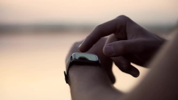 Heart Rate On Display Smartwatch. Runner Checking Pulse Smartwatch App. Pulse On Smart Watch. alt