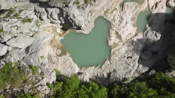 aerial drone headshot of Albanian canyon "Syri i ciklopit". Albanian nature stock videos. alt