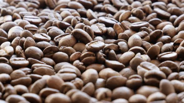 Arabic type  coffee beans on wooden surface slow tilt 4K 2160p UltraHD footage - Slow tilting over c alt