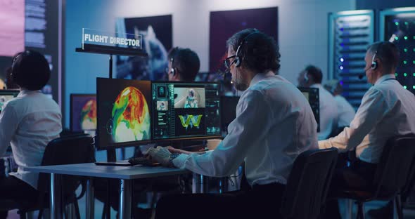 Flight Control Team Celebrating Rocket Launch alt