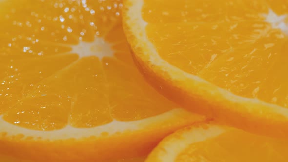 Colorful Citrus Fruit Slices of Orange on Rotating Surface  Close Up Macro