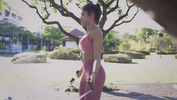 Woman Doing Rope Skipping in the Park alt
