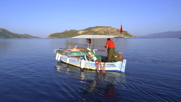 Turkish Fisherman People Fishing By Boat At Sea In Turkey