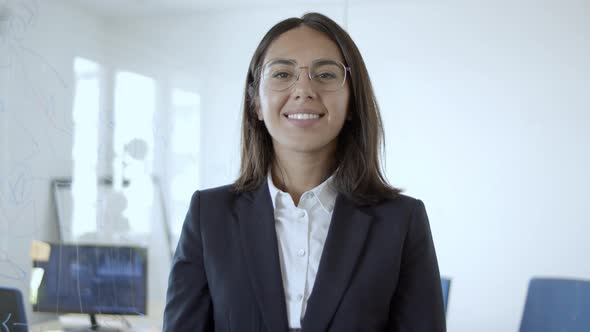 Happy Young Latin Businesswoman Wearing Suit alt