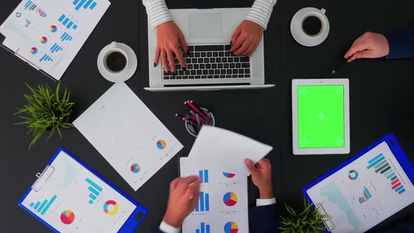 People in Conference Room Working with Green Screen Tablet alt