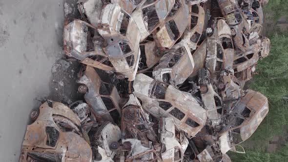 Vertical Video of a Dump of Wardestroyed Cars in Ukraine alt