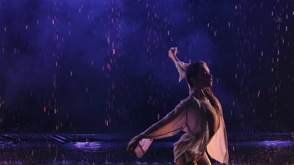 Contemporary Dance Ballerina Dances Sensually in Rain on Water Surface Creating Splashes alt