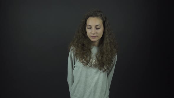 Actress with Long Curly Hair Plays Role Standing on Stage alt