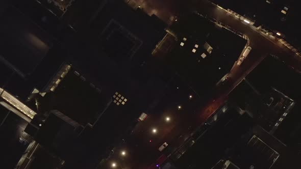 AERIAL: Slow Overhead Shot of City at Night with Lights and Traffic, Cologne, Germany  alt