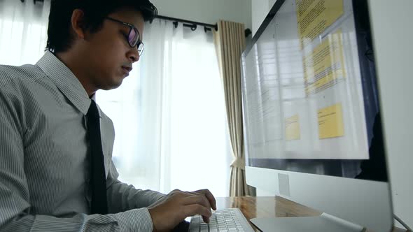 Close up of business man hands typing on a  computer keyboard, white keyboard