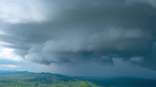 Thunderstorm and Black clouds moved over the mountains.